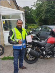 Mod1 pass - Bini proudly holding his pass certificate.
